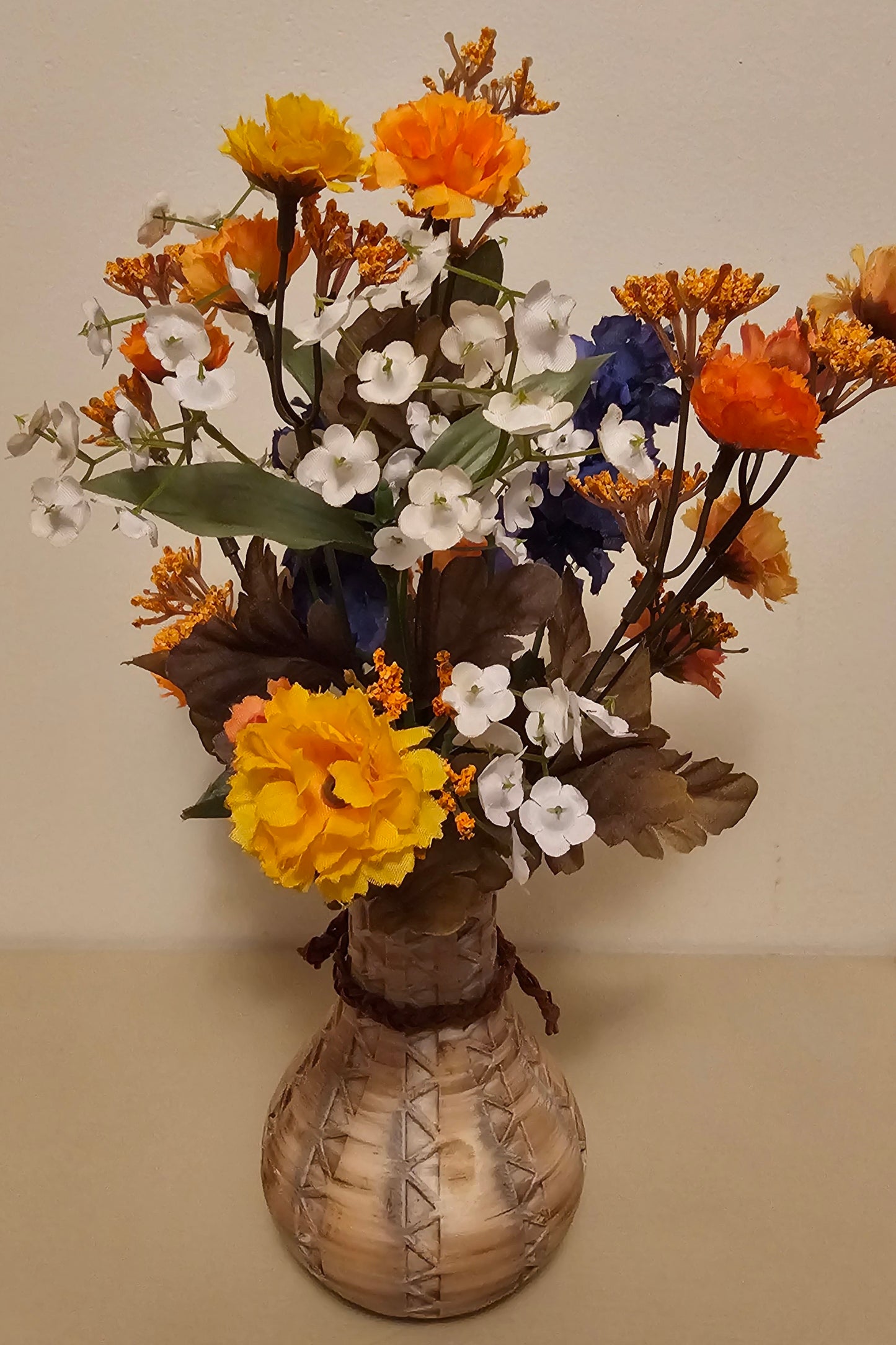 Weathered Southwest Vase with Orange. White, & Blue Silk Flowers